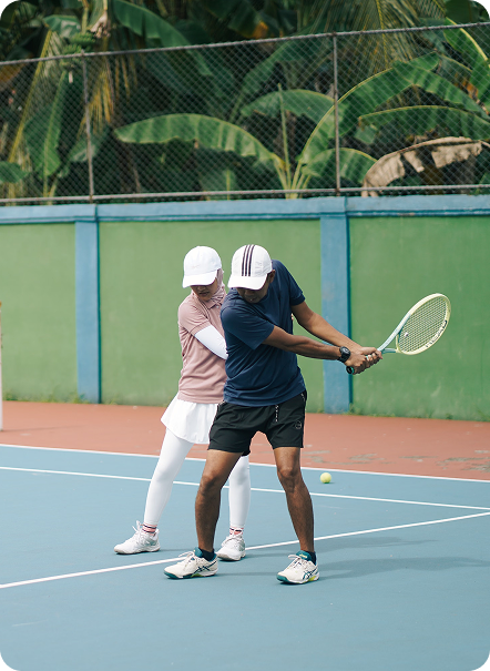 Coaching a backhand on court